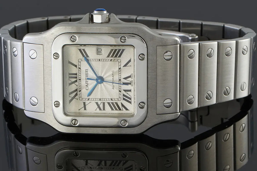 Vintage Cartier watch with stainless steel bracelet featured in a buying guide explaining what to check before purchasing