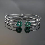 18KT White Gold Emerald and Diamond Open Bangle with Circular Cluster Accents