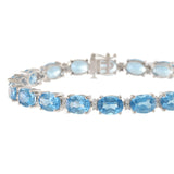 14KT White Gold Oval Blue Topaz and Diamond Bracelet