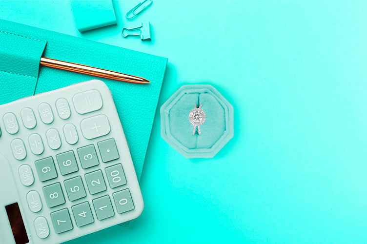 Jewelry appraisal report concept with calculator, notepad, and diamond ring used for insurance valuation
