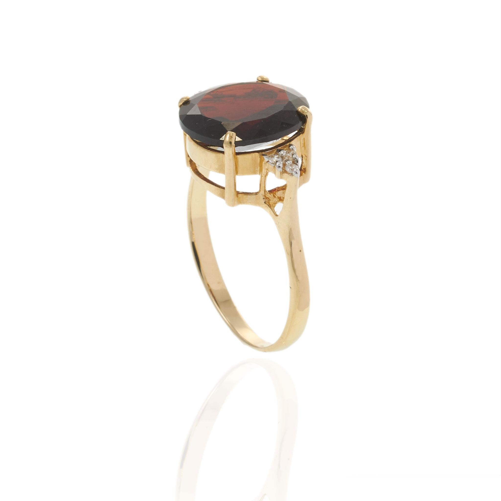 14KT Yellow Gold 4.77CT Oval Garnet and Diamond Ring