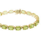 14KT Yellow Gold Bracelet with Oval Peridots and Round Cut Diamonds