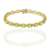 14KT Yellow Gold Bracelet with Oval Peridots and Round Cut Diamonds