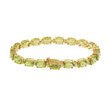 14KT Yellow Gold Bracelet with Oval Peridots and Round Cut Diamonds