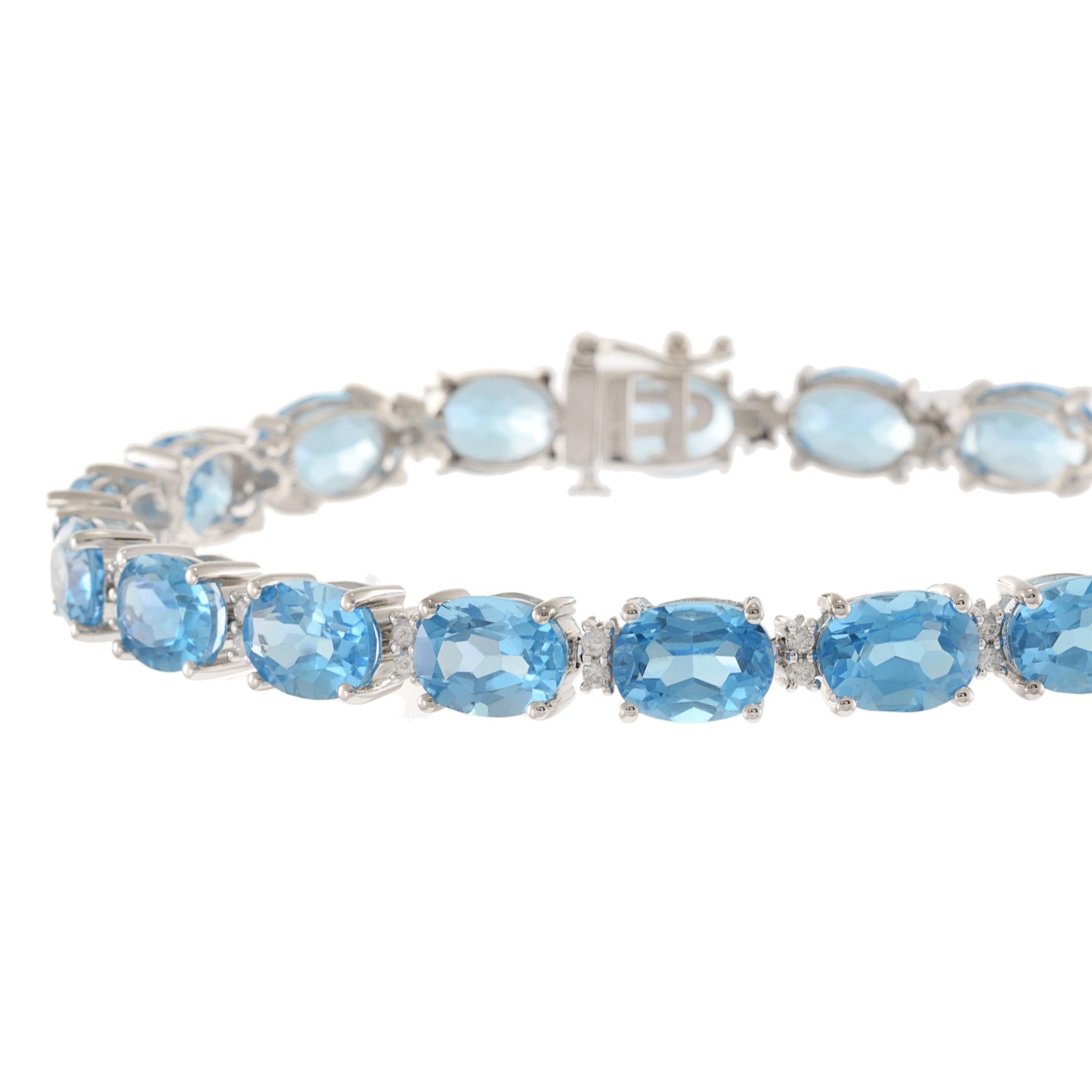 14KT White Gold Oval Blue Topaz and Diamond Bracelet