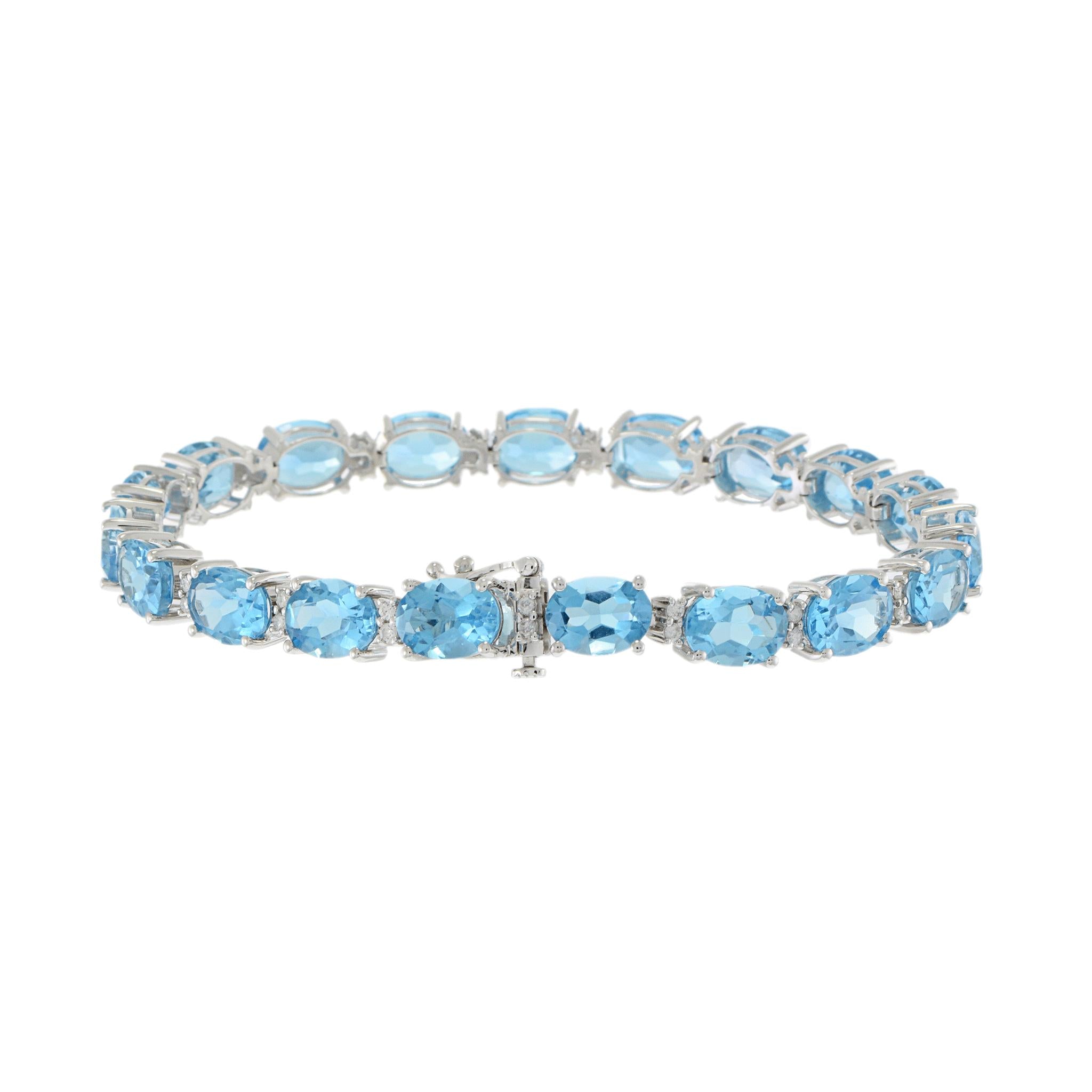 14KT White Gold Oval Blue Topaz and Diamond Bracelet