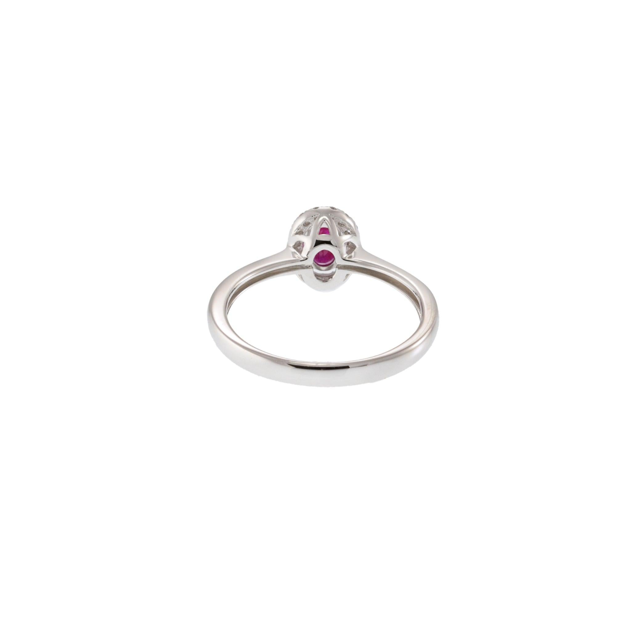 18KT White Gold Oval Ruby Ring with Diamond Halo