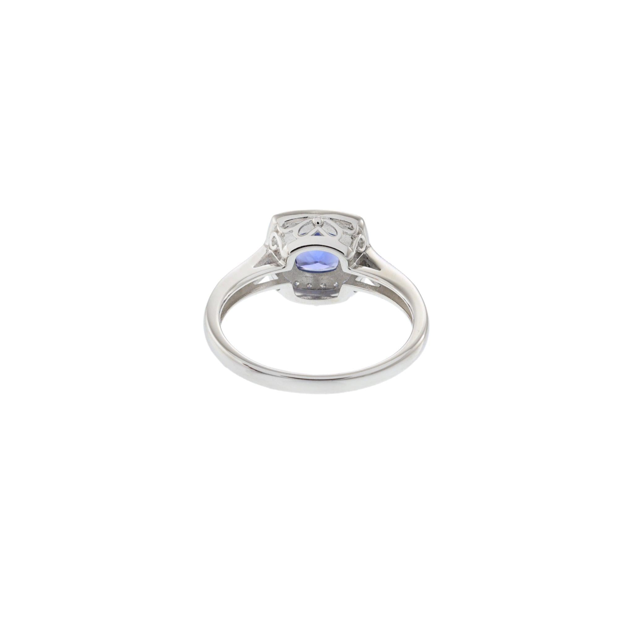 14KT White Gold Tanzanite and Diamond Halo Ring