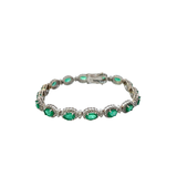 14KT White Gold Round Cut Diamond And Oval Emerald Bracelet