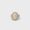 14KT Yellow Gold Round Cut Diamond And Oval Opal Center Ring