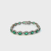 14KT White Gold Round Cut Diamond And Oval Emerald Bracelet