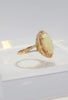 14KT Yellow Gold Large Oval Opal Set With Double Halo Ring