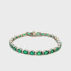 14KT White Gold Round Cut Diamond And Oval Emerald Bracelet