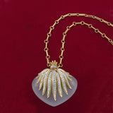 Vintage Retro crystal and diamond heart pendant/brooch on gold chain in 18KT gold at Louis Martin Jewelers NYC