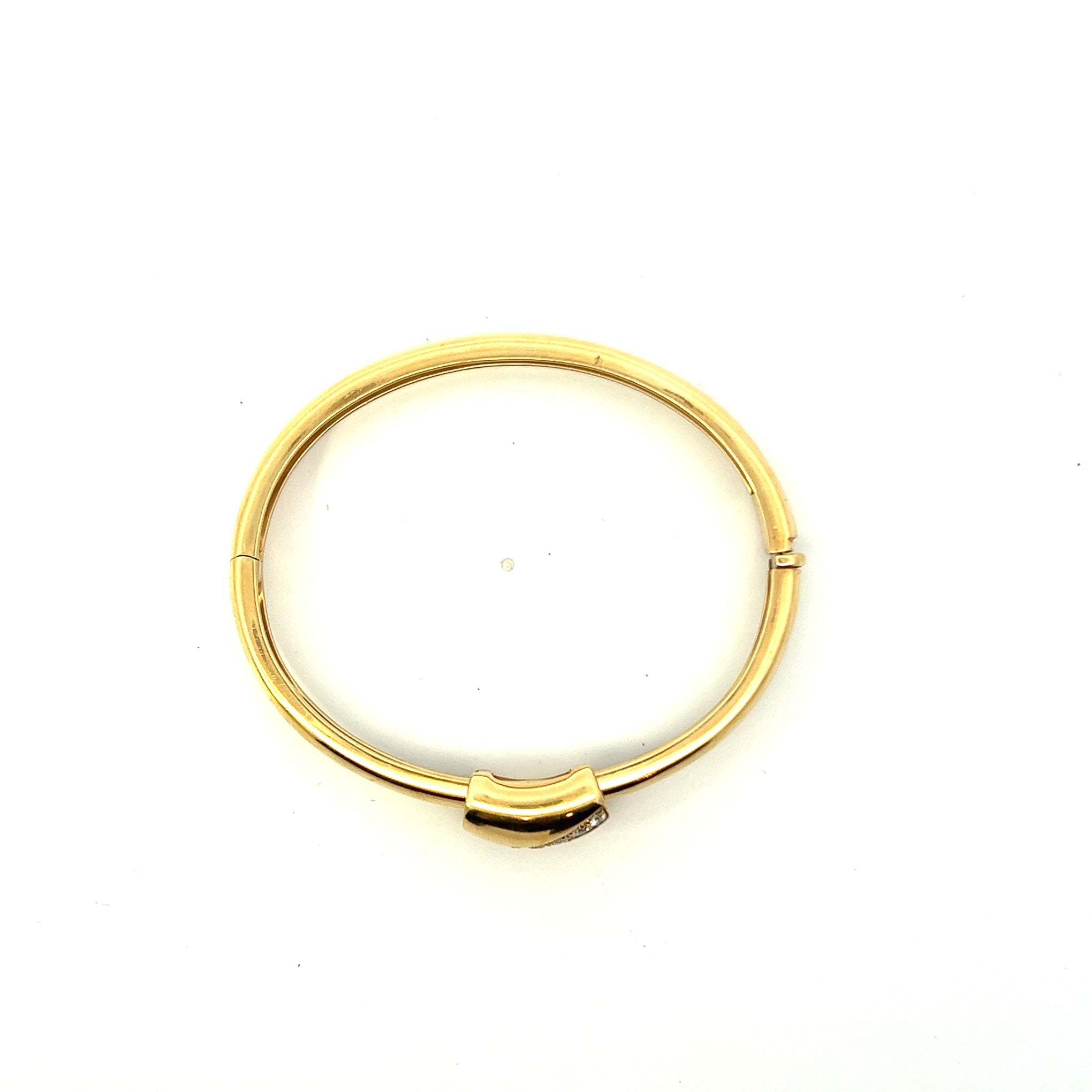 VINTAGE PIAGET 18KT YELLOW GOLD AND ROUND CUT DIAMOND BANGLE