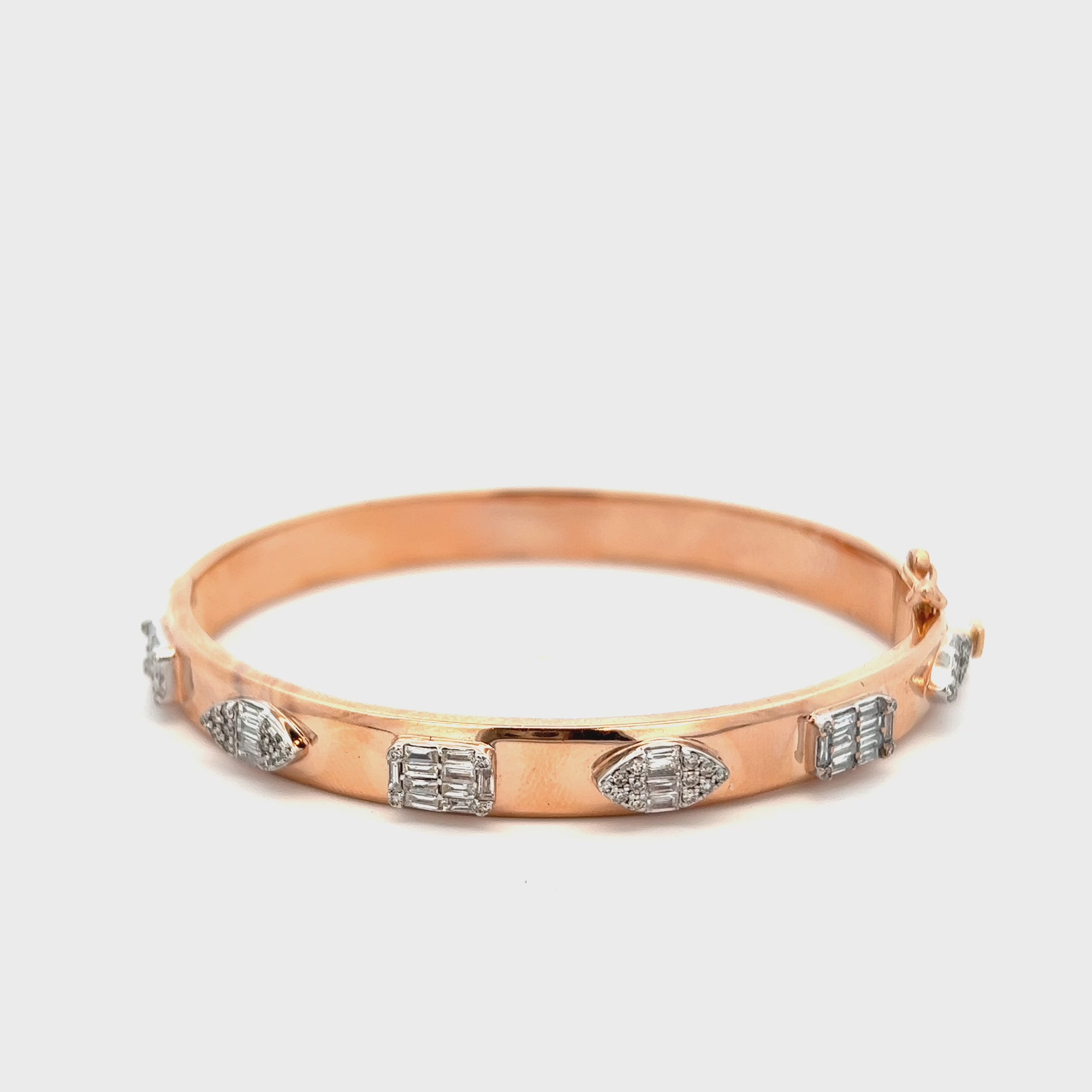 14KT ROSE GOLD WITH ROUND AND BAGUETTE CUT DIAMONDS ALTERNATING SHAPE BRACELET.